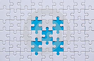 Jigsaw puzzle white color,Puzzles pieces grid,Success mosaic solution template,Horizontal on blue color background copy space for