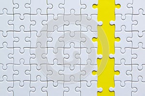 Jigsaw puzzle white color on yellow background,Row puzzle pieces grid,Success mosaic solution template