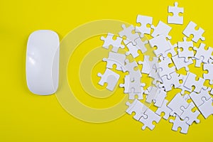 A jigsaw puzzle on a yellow background Business idea