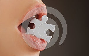 Jigsaw solution. Life problems. Female mouth with puzzle piece.