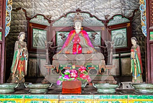 Jinci Memorial Temple(museum) scene. Saintly Mother and maidservants coloured clay sculpture at the Saintly Mother hall