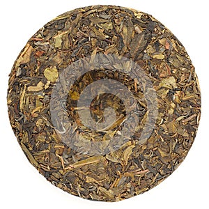 Jingmai Gu Shu Huang Pian Raw Puerh tea in round shape isolated photo