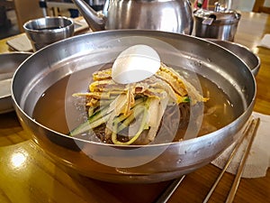 Jinju Naengmyeon, Korean noodle dish of handmade noodles made from buckwheat and cold broth made from beef.