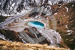 Jinvali Water Reservoir blue lake in Caucasian Mountain in winter. Cross Pass in Georgia. Gudauri District. Source of Aragvi River