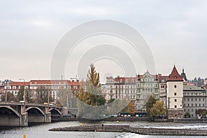 Jirasek bridge, also called Jiraskuv Most, in Prague, Czech Republic, over the Vltava river, with a view of the Smichov and Andel