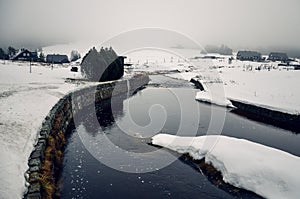 Jizerka village and river covered by snow in the winter