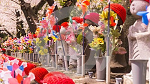 Jizo Japanese sculptures at Zojoji Temple in spring time at Tokyo Japan