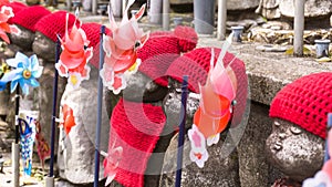 Jizo Japanese sculptures at Zojoji Temple in spring time at Tokyo Japan