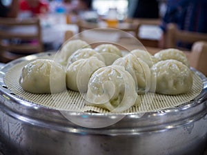 Jjin mandu, or Korean style steamed dumpling filled with a mixture of ingredients including ground pork, kimchi, vegetables.