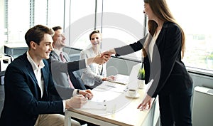 Job applicant having interview. Handshake while job interviewing.