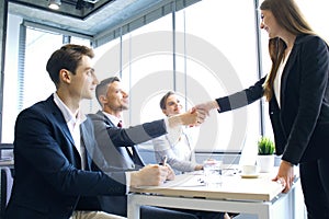 Job applicant having interview. Handshake while job interviewing.