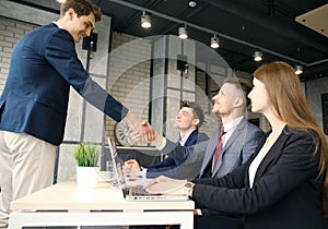 Job applicant having interview. Handshake while job interviewing.