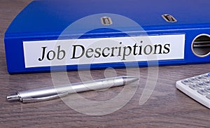 Job Descriptions binder in the office