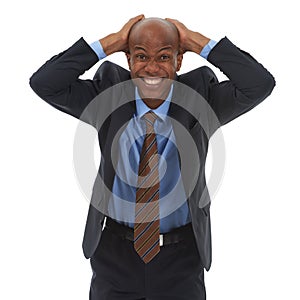 This job is driving me crazy. Studio portrait of a businessman holding his head in frustration isolated on white.