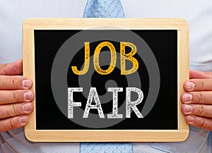 Job Fair - Manager holding chalkboard with text