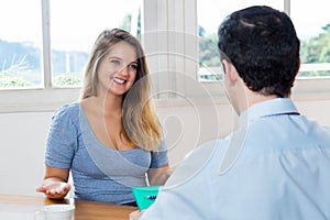 Job interview of blonde yound adult woman