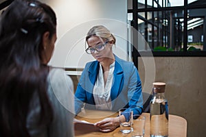 Job interview or business meeting face - to-face. Two business women at a meeting