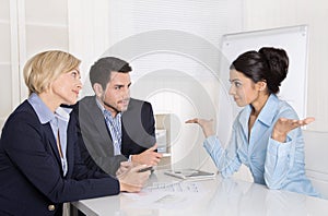 Job interview or business meeting: man and woman sitting at the