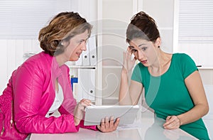 Job interview or business meeting under two woman.