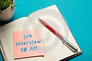 Job interview concept . Office table top view. Notepad, pen and reminder with word