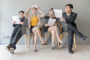 Job Interview. Group of asian people review document while waiting for job interview