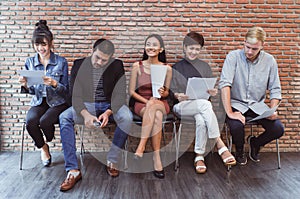 Job Interview. Group of multiethnic casual businesspeople while waiting for job interview creative design, somepeople happy and