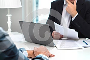 Job interview or meeting with bank worker in office.