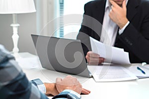 Job interview or meeting with bank worker in office. photo