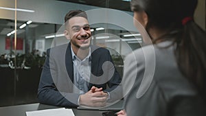 Job interview. Professional arab man hr talking to woman job seeker at office, asking her about business experience