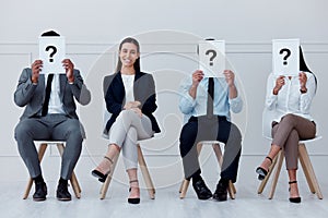 Job interview, question mark and feedback with business people sitting with sign for review, recruitment and search. Why