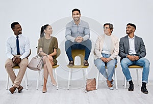 Job interview, waiting and candidates with man on chair for recruitment, diversity and unique with white background