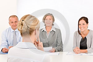 Job interview young woman with business team photo