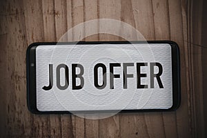 Job Offer text on a smart phone screen - Business Concept