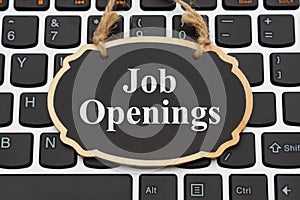 Job Openings message on chalkboard on a keyboard photo