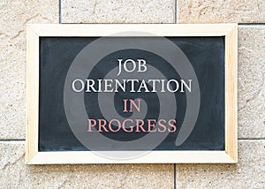 Job orientation in progress, words on blackboard