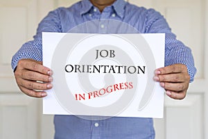 Job orientation in progress, words printed on white paper