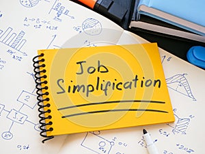 Job simplification inscription and notepads with calculations.