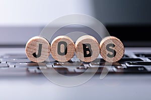 Jobs Text On Wooden Blocks Over Keyboard photo