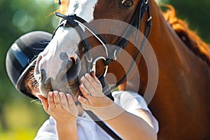 Jockey with purebred horse photo