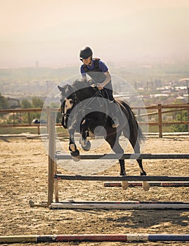 Jockey riding a fast thoroughbred horse