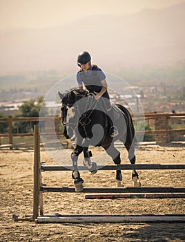 Jockey riding a fast thoroughbred horse