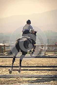 Jockey riding a fast thoroughbred horse