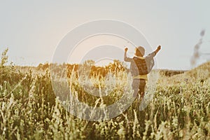 Jocund child rejoicing beautiful morning on nature