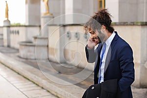 Jocund mulatto guy raving near Eiffel Tower and calling friend b