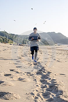 Jogger approaching along the beach