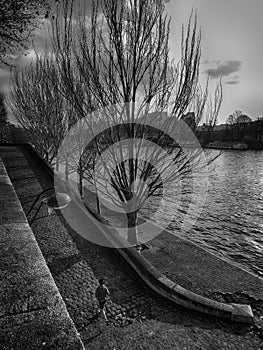 Jogger on a ramp beside the river Seine