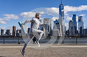 The jogger run at sport training. Sportsman jogger running or jogging. Man in sports suit training jogging. Running man
