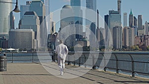 The jogger run at sport training. Sportsman jogger running. Man in sports suit training. Running man in Manhattan. Copy