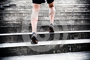 Jogger running on stairs, sports training