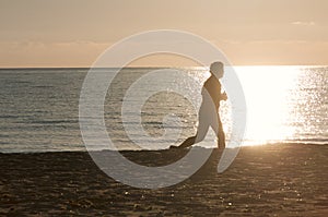 Jogger silhouette on beach